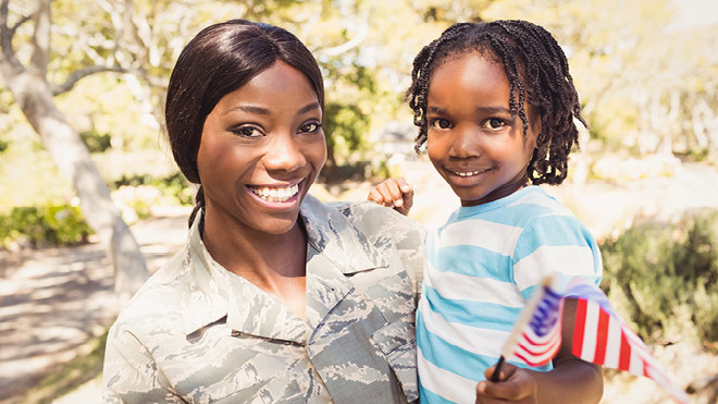 Military mom holding her daughter