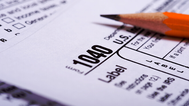A pencil on a 1040 tax document.