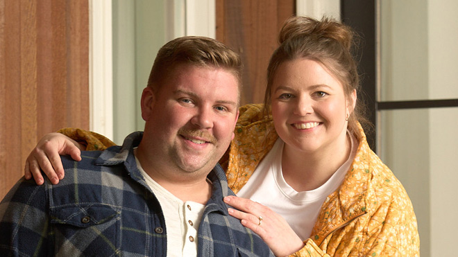 a man and woman smiling for a picture