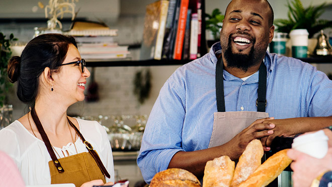 a man and woman smiling at each other