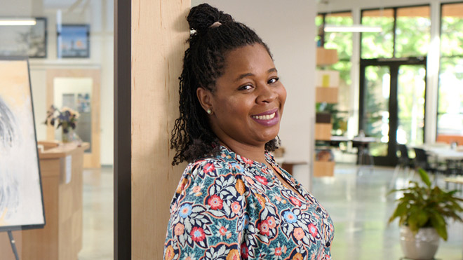 Smiling woman wearing a floral blouse