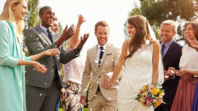 a group of people walking down a path