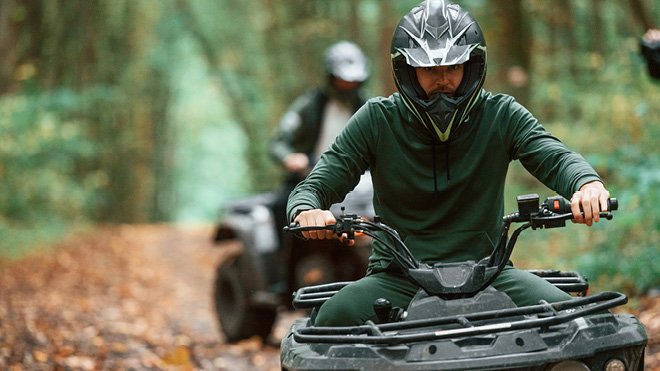 a man riding a atv