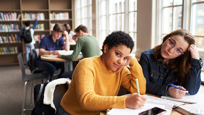 a group of people sitting at tables