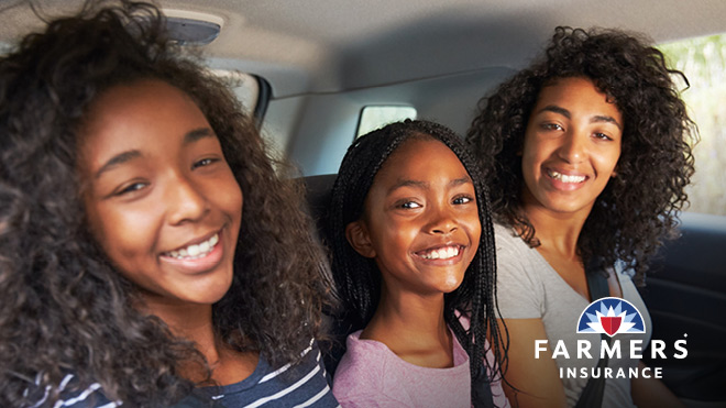 Three young women riding in a car, Farmers Insurance
