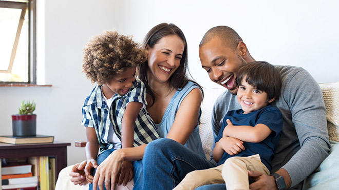a family sitting on a couch