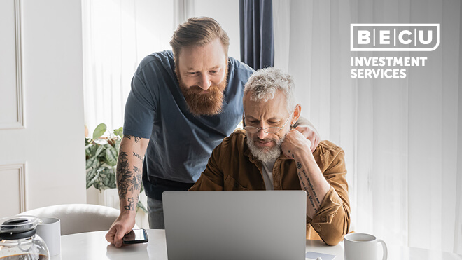 Two men looking at a laptop screen. BECU Investment Services logo.