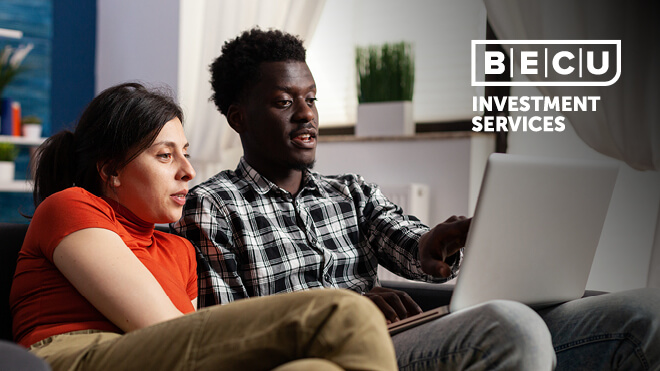 A man and woman looking at something on a laptop. BECU Investment Services logo.