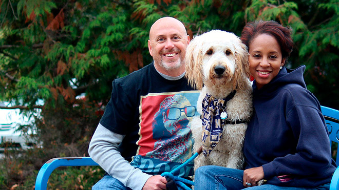Couple on a bench with their dog
