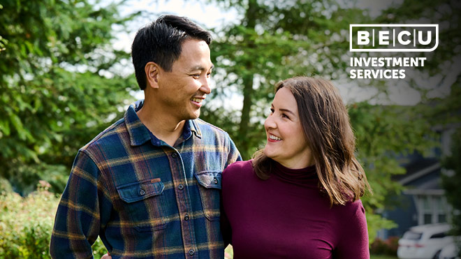 Man and woman smiling at each other while walking outside together. BECU Investment Services logo.