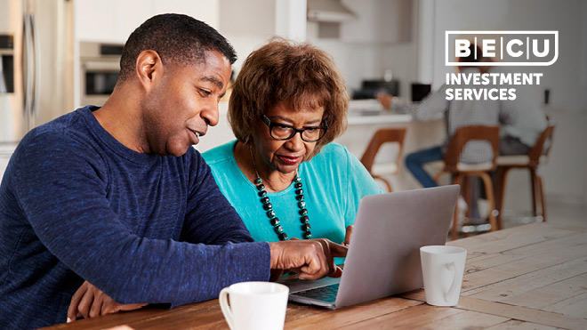 A man and woman looking at a laptop screen. BECU Investment Services logo.