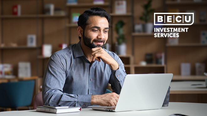 A man looking at a laptop. BECU Investment Services logo.