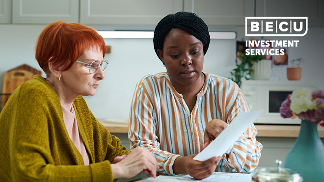 Two women reviewing a tax document. BECU Investment Services logo.