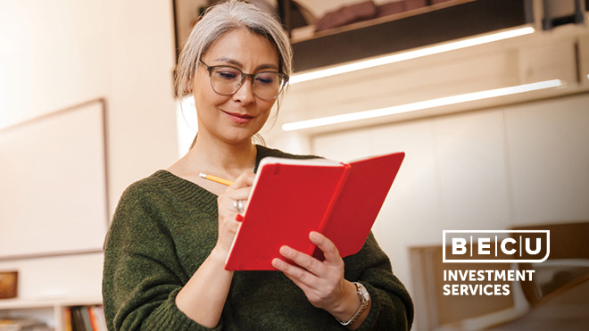A woman writing in a notebook. BECU Investment Services logo.