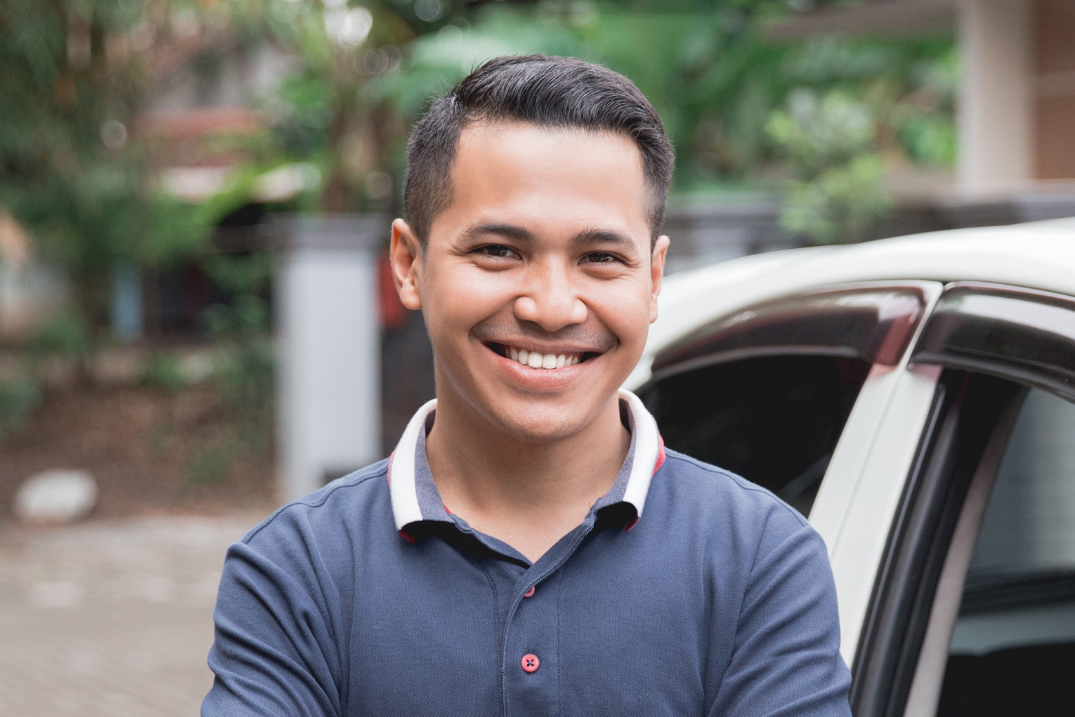 Man standing in front of car