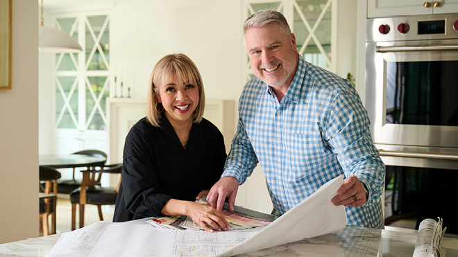 Couple looking at plans for their home