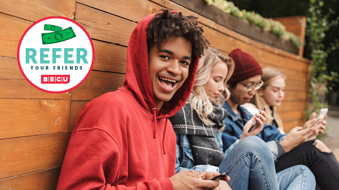 Smiling young man wearing a red hoodie