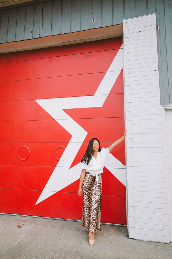 Emma C. posing by wall