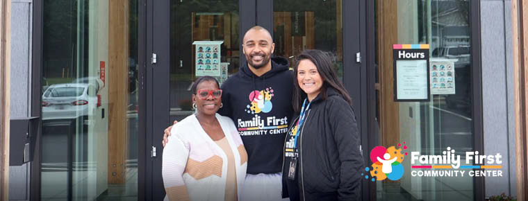 BECU'S Gloria Dixon poses with Doug Baldwin Jr and Jackie Montgomery from the Family First Community Center.