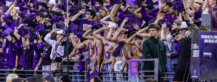 A group of UW Football fans at a game.