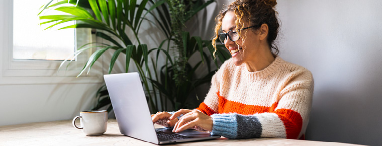 A woman working on her laptop.