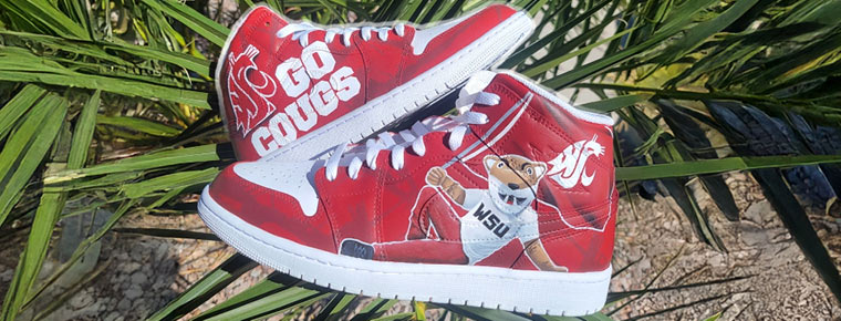 Red athletic shoes with the WSU Cougar Mascot image on them
