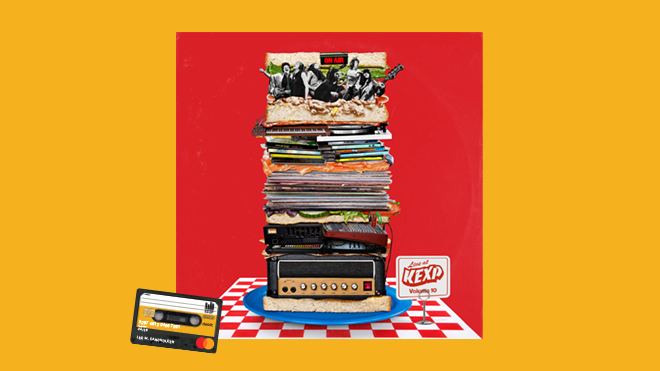 KEXP Debit Card next to a stack of music albums.