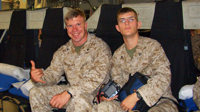 BECU employee Bobby H. and another military member pose for a photo in their Marine Corps uniforms. 
