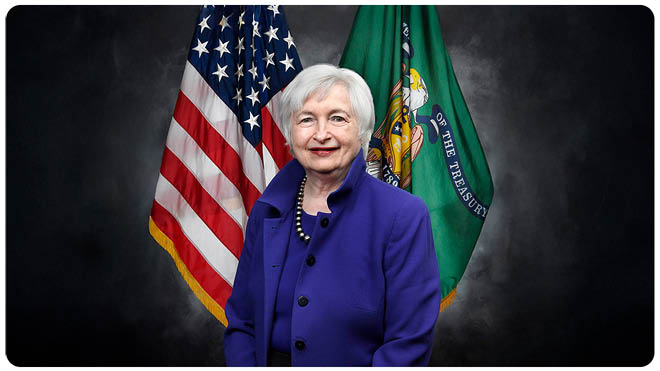 Portrait of Janet Yellen standing in front of the American flag and Treasury Department flag.
