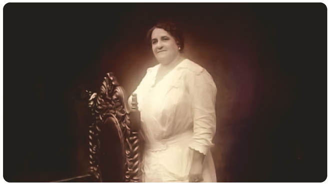 Portrait of Maggie Lena Walker standing next to an ornate high-backed chair