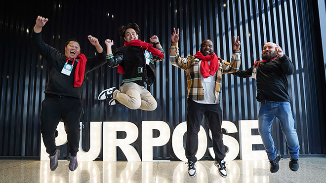 A group of happy BECU employees jumping in the air