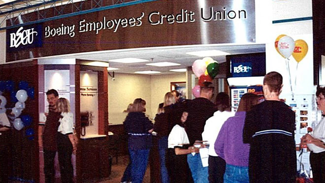 A group of people in front of BECU's first Neighborhood Financial Center in Safeway