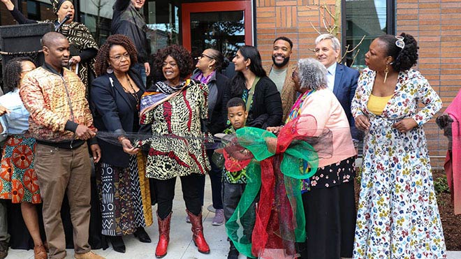 a group of people outside wearing colorful clothing