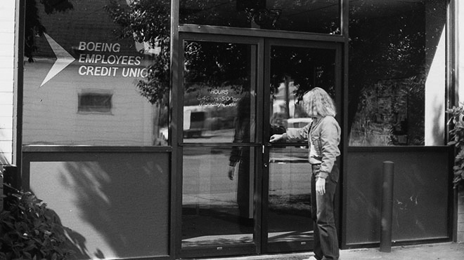 a woman entering the Georgetown BECU location