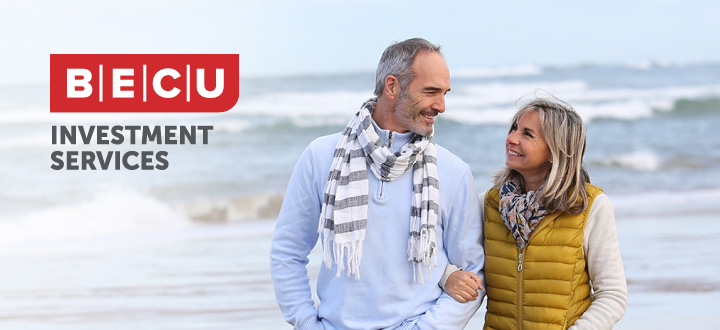 Retirement age couple walking on the beach